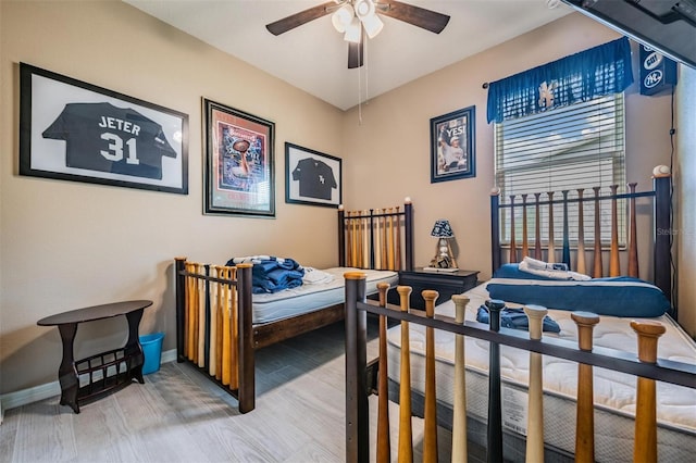 bedroom featuring ceiling fan and hardwood / wood-style floors