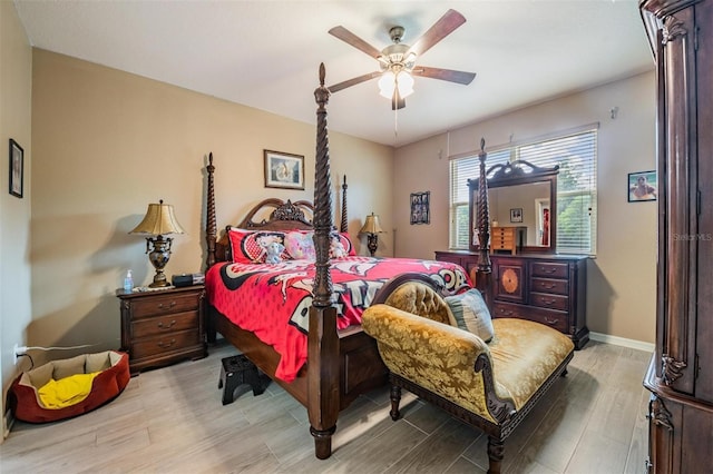 bedroom with ceiling fan and light hardwood / wood-style flooring