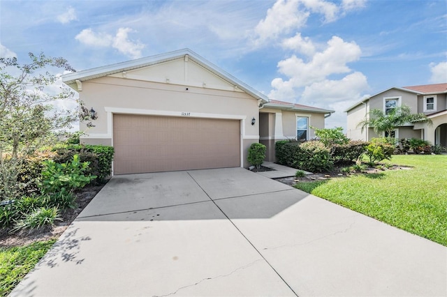 view of front of house featuring a front yard and a garage