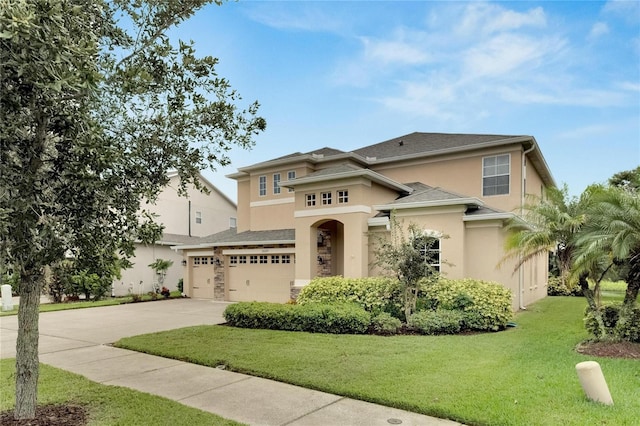 view of front facade featuring a front yard and a garage