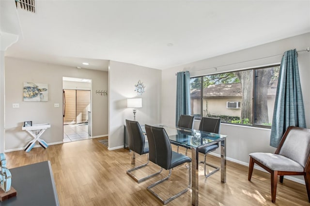 dining room with light hardwood / wood-style flooring