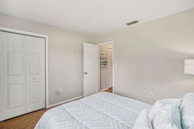 bedroom featuring light hardwood / wood-style flooring and a closet