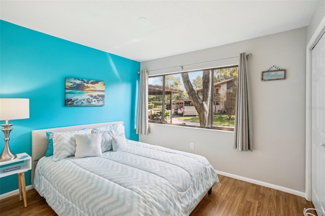 bedroom with hardwood / wood-style floors