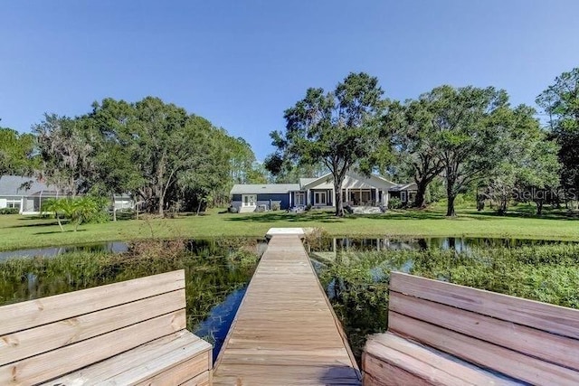 dock area with a water view