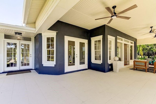 view of patio featuring ceiling fan and french doors