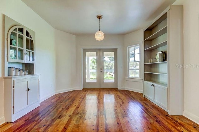 doorway to outside with french doors and dark hardwood / wood-style floors