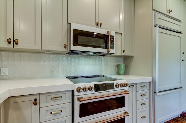 kitchen with tasteful backsplash and premium appliances