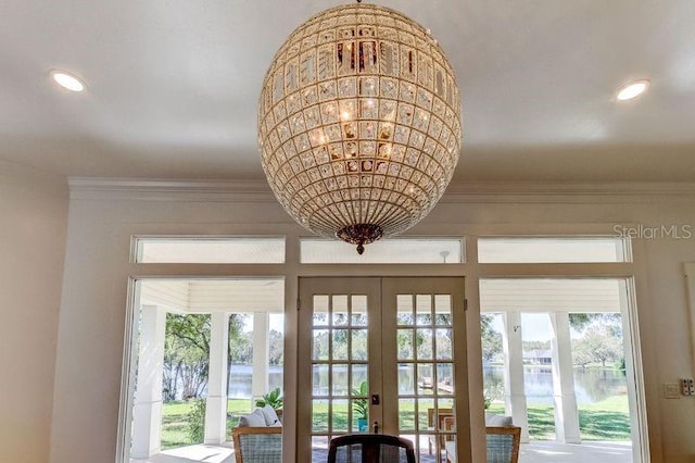 entryway featuring french doors and a water view