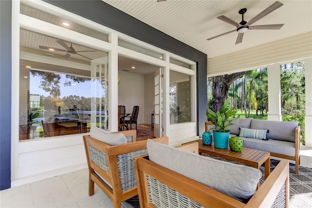 sunroom with ceiling fan and plenty of natural light