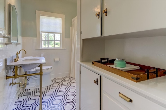 bathroom featuring tile patterned floors and toilet