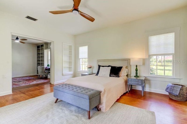 bedroom featuring hardwood / wood-style flooring and ceiling fan