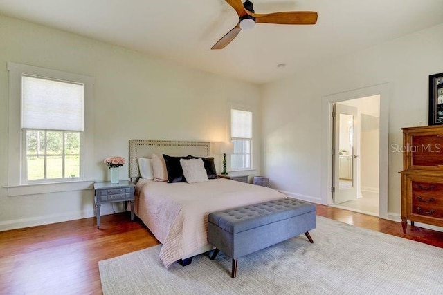 bedroom featuring hardwood / wood-style flooring and ceiling fan