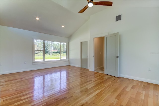 unfurnished room featuring ceiling fan, light hardwood / wood-style flooring, and high vaulted ceiling