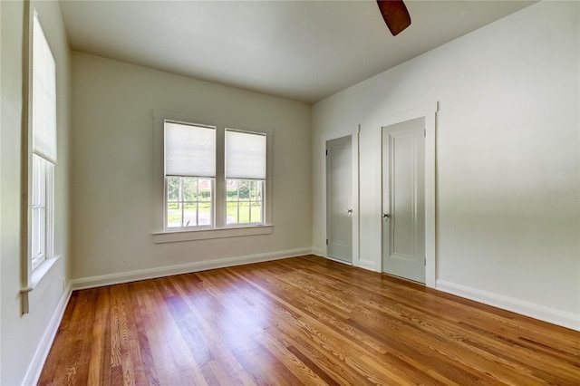 spare room featuring hardwood / wood-style flooring and ceiling fan