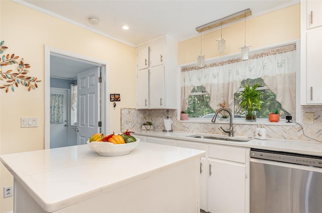 kitchen with a kitchen island, sink, pendant lighting, dishwasher, and white cabinetry