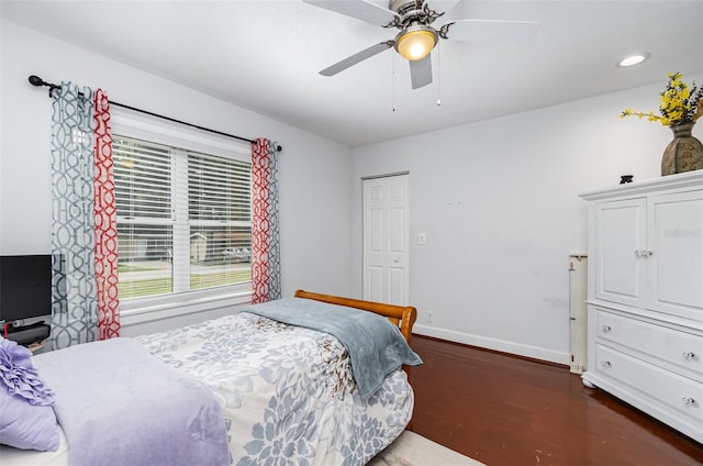 bedroom featuring ceiling fan and dark wood-type flooring