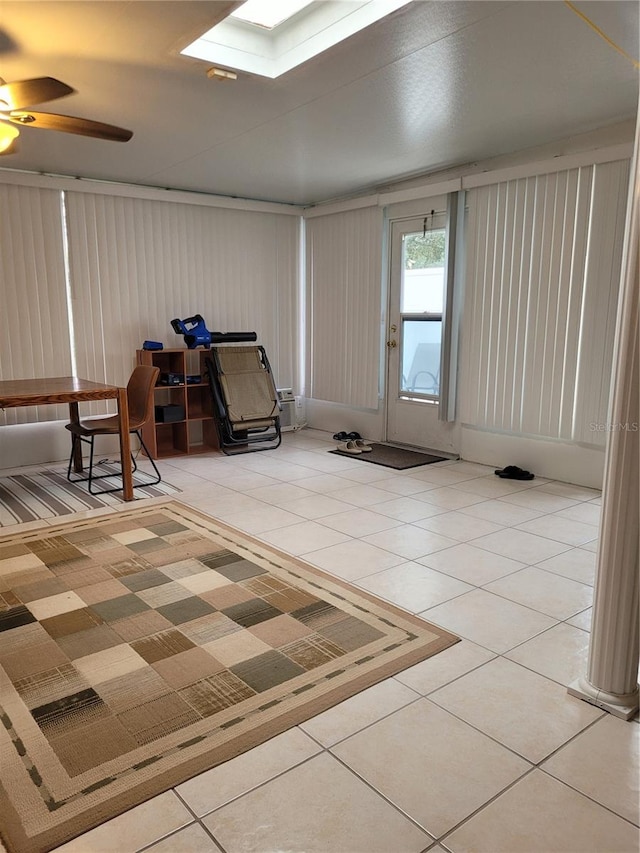 tiled entryway featuring ceiling fan