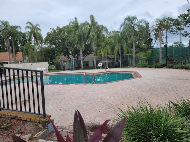 view of swimming pool with a patio