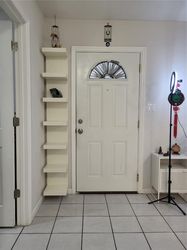 foyer featuring light tile patterned flooring