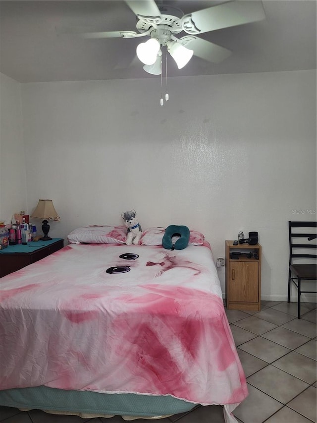 bedroom featuring ceiling fan and light tile patterned flooring