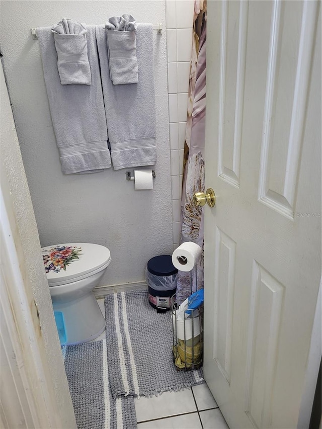 bathroom featuring tile patterned flooring and toilet