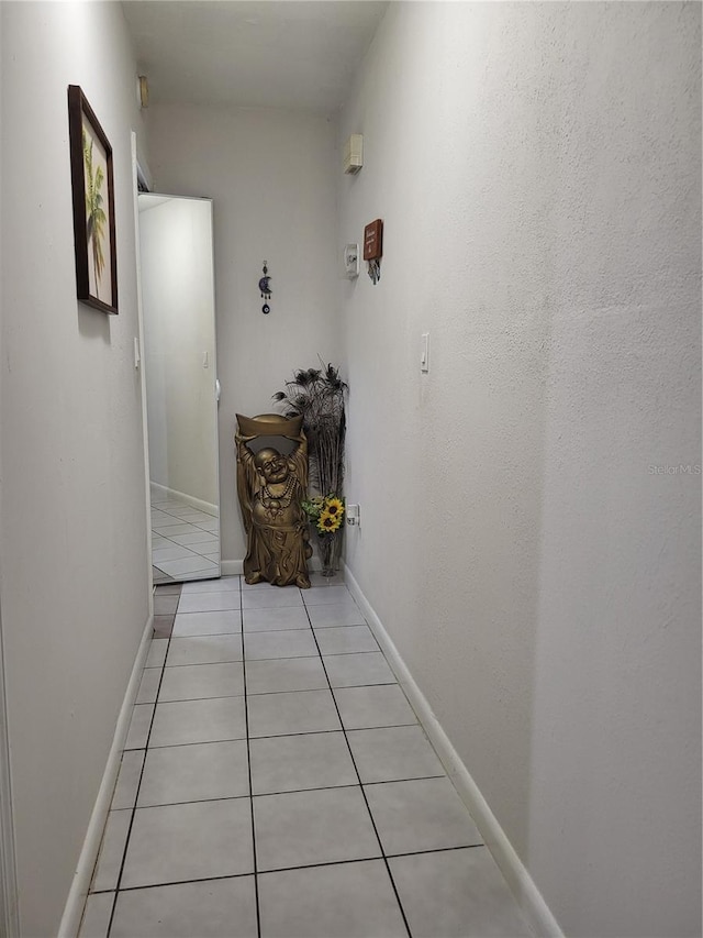 hallway with light tile patterned floors