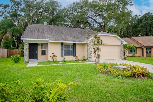 ranch-style house featuring a front yard and a garage