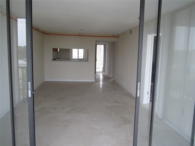 empty room featuring a textured ceiling