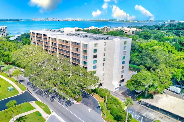 birds eye view of property with a water view