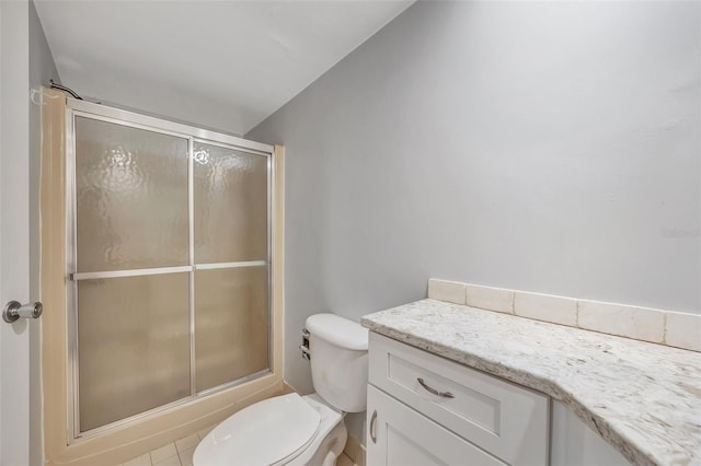 full bathroom with tile patterned floors, shower / bath combination with glass door, vanity, and toilet