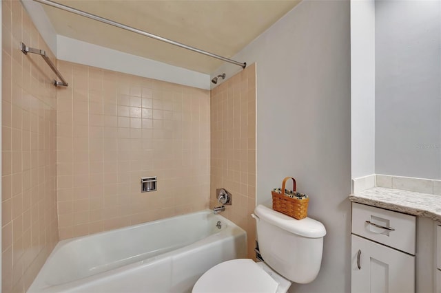 full bathroom featuring vanity, toilet, and tiled shower / bath