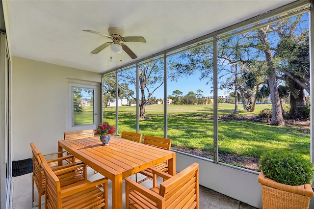 sunroom featuring ceiling fan