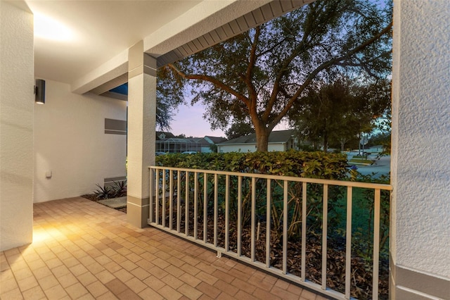 view of balcony at dusk