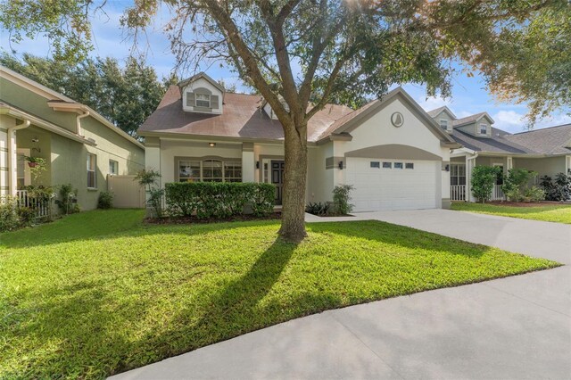 view of front of house featuring a garage and a front yard