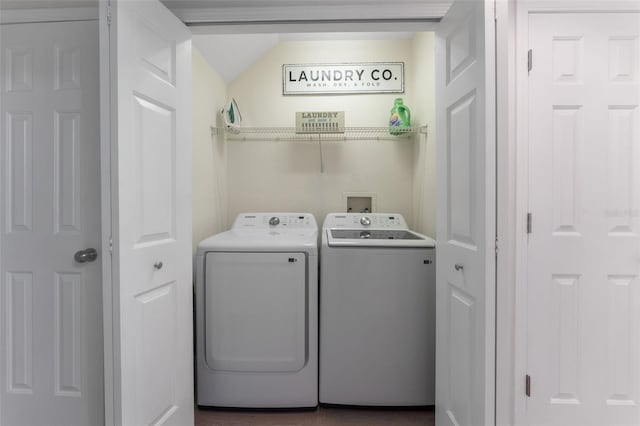 clothes washing area with washing machine and clothes dryer