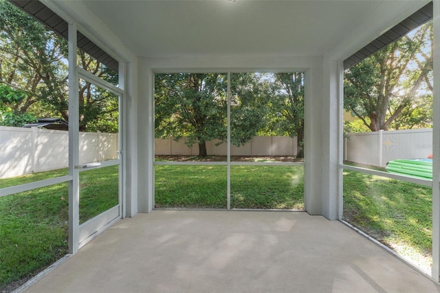 unfurnished sunroom featuring a wealth of natural light