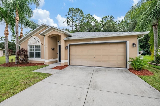 single story home with a front lawn and a garage