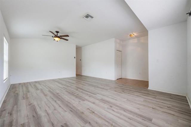 interior space featuring lofted ceiling, light wood-type flooring, and ceiling fan