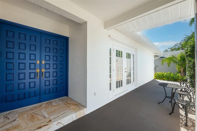 property entrance with french doors and a patio area