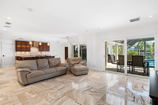 living room featuring ornamental molding