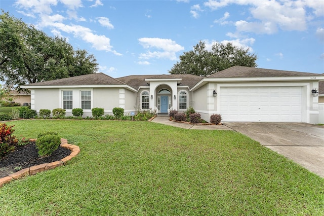 single story home with a garage and a front lawn