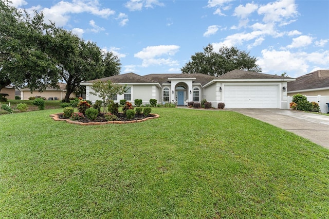 ranch-style house with a garage and a front yard