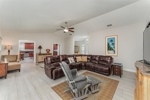 living room featuring lofted ceiling and ceiling fan