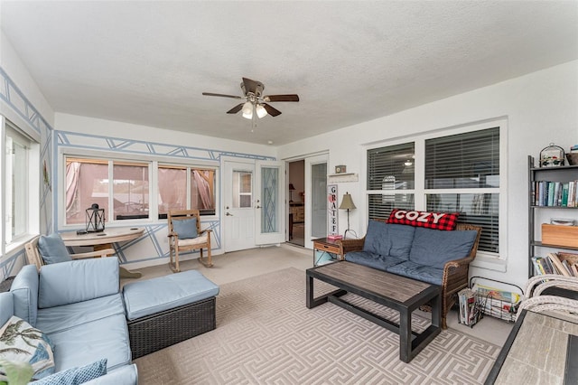 sunroom featuring ceiling fan