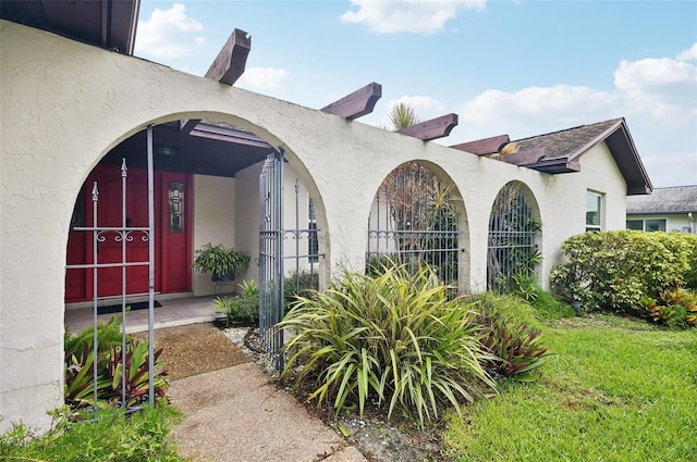 entrance to property with a yard