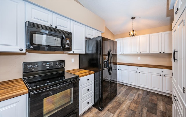 kitchen with dark hardwood / wood-style flooring, black appliances, decorative light fixtures, white cabinets, and butcher block countertops