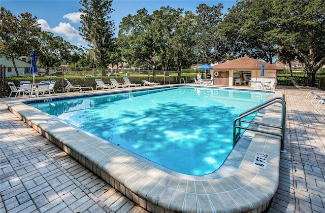 view of swimming pool featuring a patio area