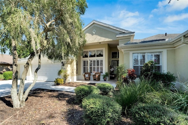 view of exterior entry with a garage