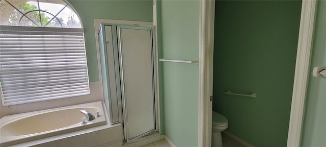 bathroom featuring independent shower and bath and toilet