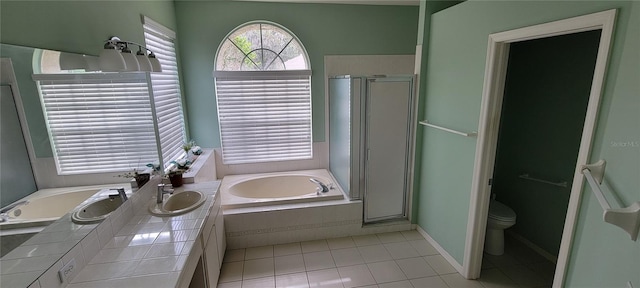 bathroom with tile patterned floors, separate shower and tub, and toilet